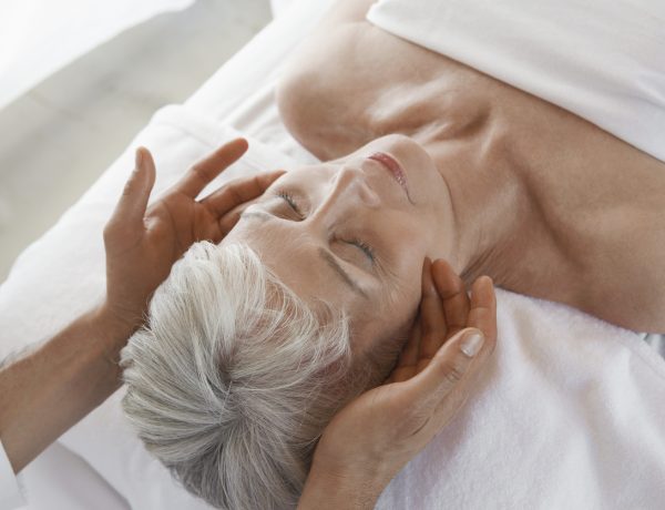 Woman Receiving a Facial Massage